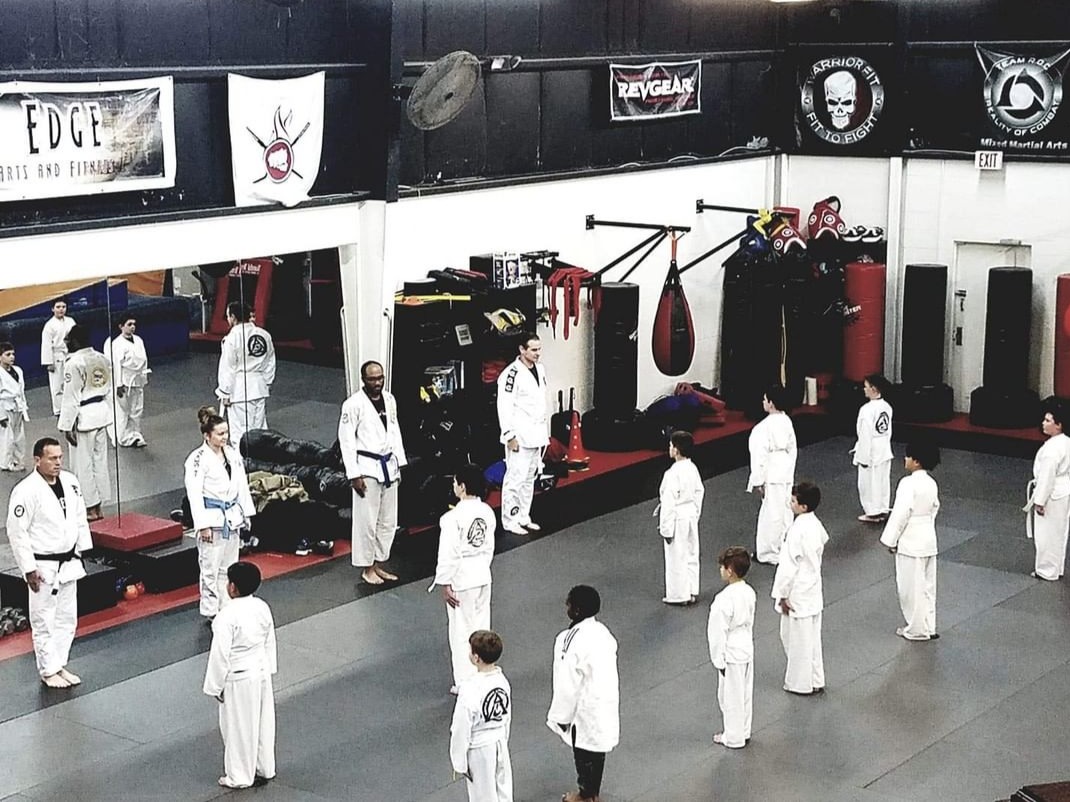 The Edge junior Jiu-Jitsu class with their instructors